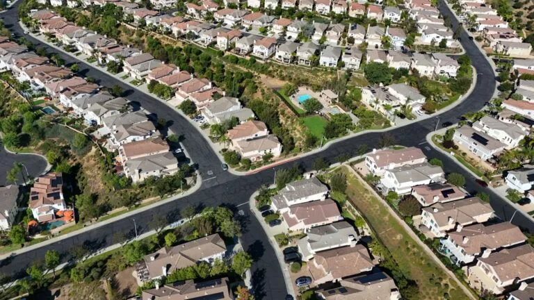 File photo: An aerial view of houses and streets in a suburban neighborhood.